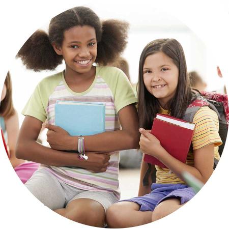 Smiling kids hold books